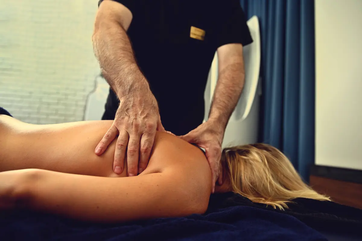 A massage therapist working on a client's back